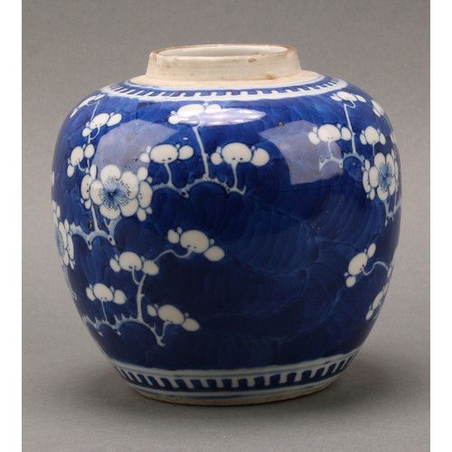 1405 - A Chinese ovoid ginger jar, painted in tones of underglaze blue with prunus on a ground of cracked i... 