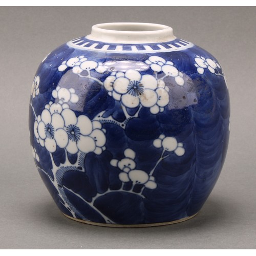 1405 - A Chinese ovoid ginger jar, painted in tones of underglaze blue with prunus on a ground of cracked i... 