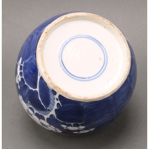 1405 - A Chinese ovoid ginger jar, painted in tones of underglaze blue with prunus on a ground of cracked i... 