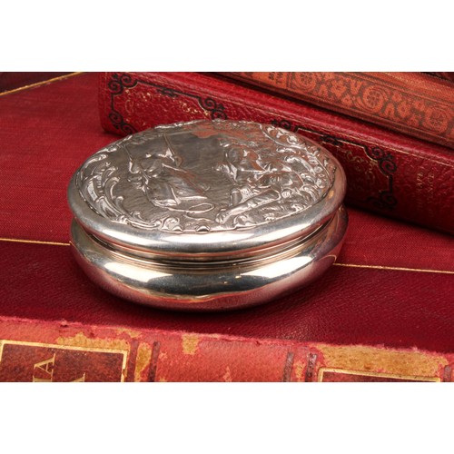 322 - A Victorian silver waisted circular box, the push-fitting cover chased with a Watteauesque scene of ... 