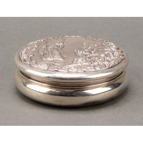 322 - A Victorian silver waisted circular box, the push-fitting cover chased with a Watteauesque scene of ... 