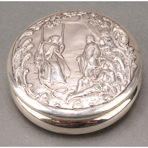 322 - A Victorian silver waisted circular box, the push-fitting cover chased with a Watteauesque scene of ... 