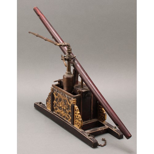 1819 - A Chinese model beam engine water pump, brass pipe work, the parcel-gilt base carved with chrysanthe... 