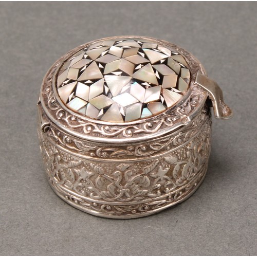 246 - An Egyptian silver and mother of pearl marquetry circular box, hinged domed cover decorated in the I... 