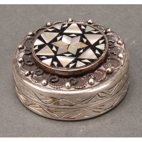 246 - An Egyptian silver and mother of pearl marquetry circular box, hinged domed cover decorated in the I... 