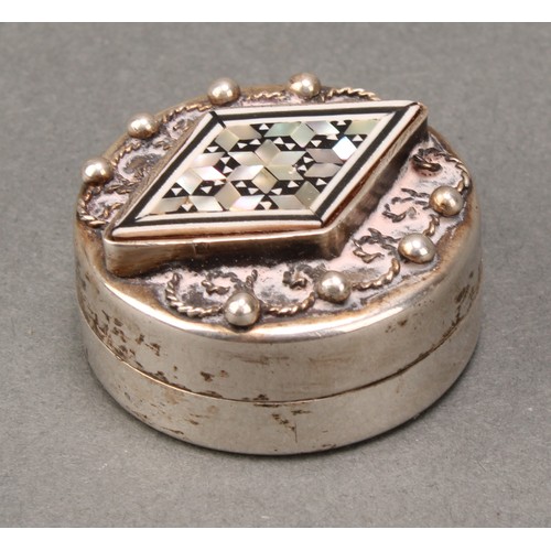 246 - An Egyptian silver and mother of pearl marquetry circular box, hinged domed cover decorated in the I... 