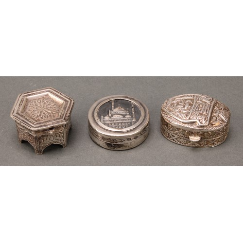 247 - An Egyptian silver circular box, the cover embossed with a view of the Mosque of Muhammed Ali, Cairo... 