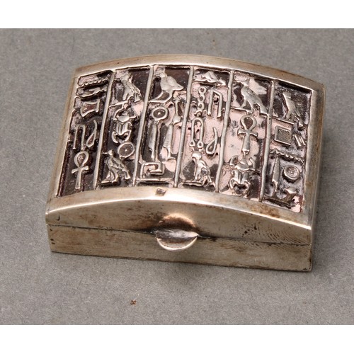 330 - An Egyptian silver rectangular box, the arched cover with hieroglyphics, 4cm wide; another, conformi... 