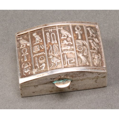 330 - An Egyptian silver rectangular box, the arched cover with hieroglyphics, 4cm wide; another, conformi... 