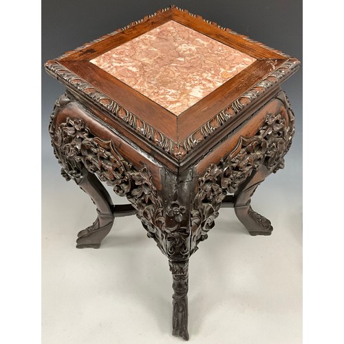 1394 - A Chinese hardwood fish bowl stand, the square top inset with a soapstone panel, above a frieze pier... 