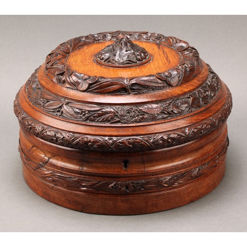 2117 - An unusual and substantial Victorian oak circular jewellery box, boldly carved with a leaf and acorn... 