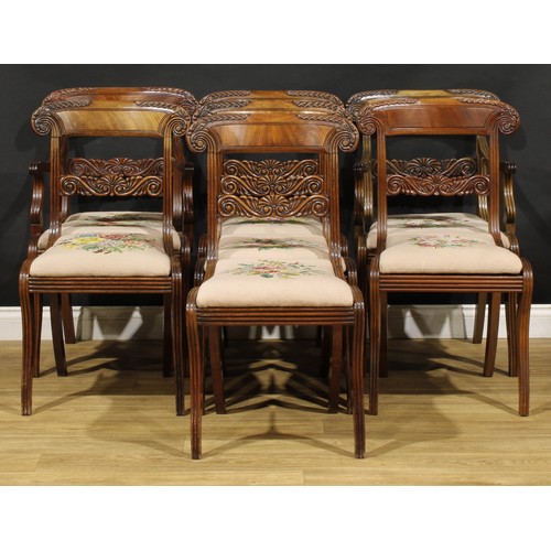 1782 - A suite of seven George IV and later mahogany dining chairs, each with a curved cresting rail carved... 