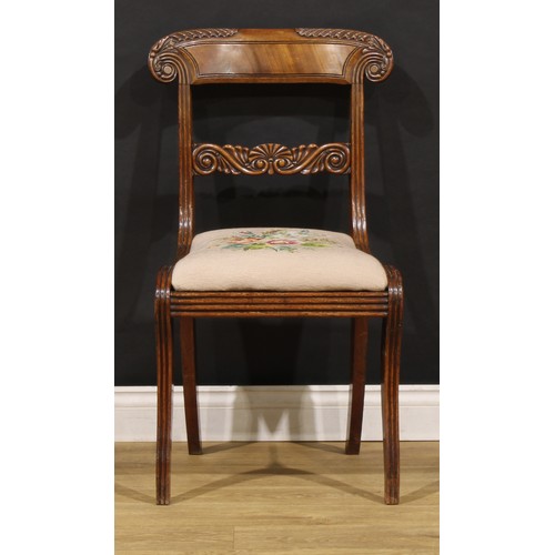 1782 - A suite of seven George IV and later mahogany dining chairs, each with a curved cresting rail carved... 