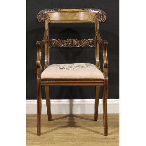 1782 - A suite of seven George IV and later mahogany dining chairs, each with a curved cresting rail carved... 