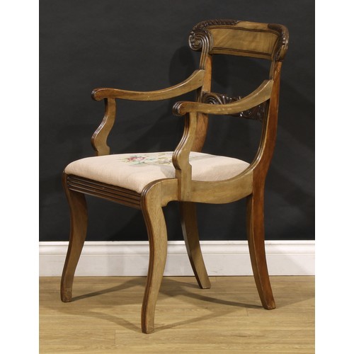 1782 - A suite of seven George IV and later mahogany dining chairs, each with a curved cresting rail carved... 