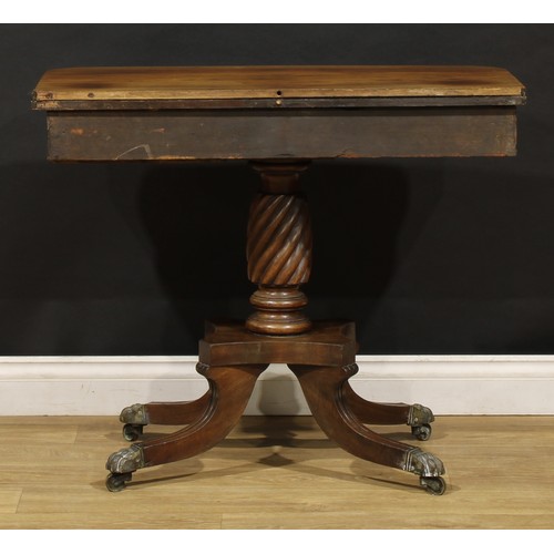 1920 - A Regency rosewood tea table, hinged top above a deep frieze outlined with brass stringing, spirally... 