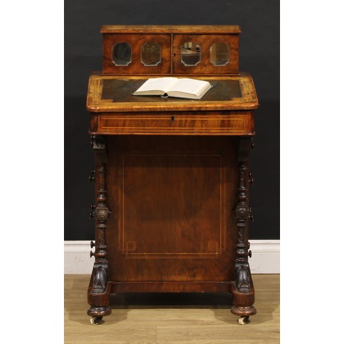 1567 - A Victorian walnut Davenport desk, rectangular superstructure with a pair of mirrored doors enclosin... 