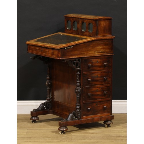 1567 - A Victorian walnut Davenport desk, rectangular superstructure with a pair of mirrored doors enclosin... 