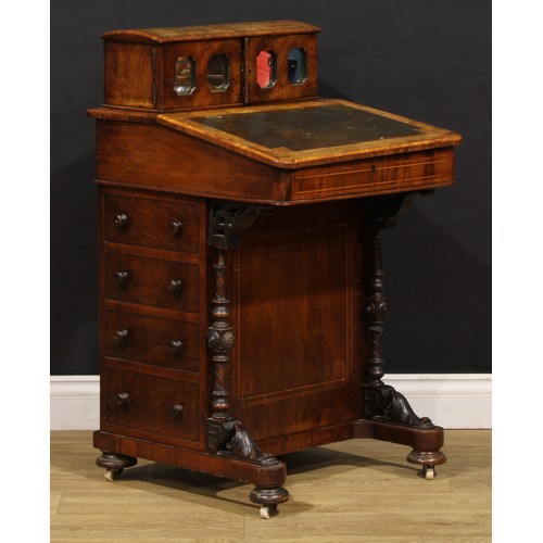 1567 - A Victorian walnut Davenport desk, rectangular superstructure with a pair of mirrored doors enclosin... 