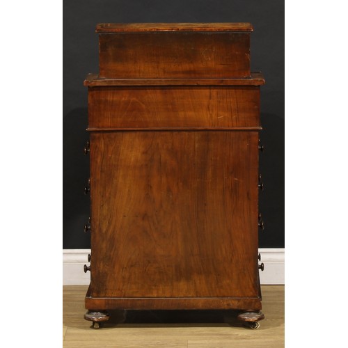 1567 - A Victorian walnut Davenport desk, rectangular superstructure with a pair of mirrored doors enclosin... 