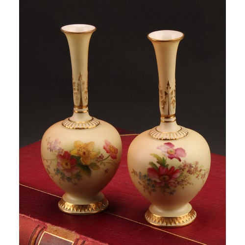 1321 - A pair of Royal Worcester blush ivory bud vases, shaped number 1661, 16.3cm high. printed marks, dat... 