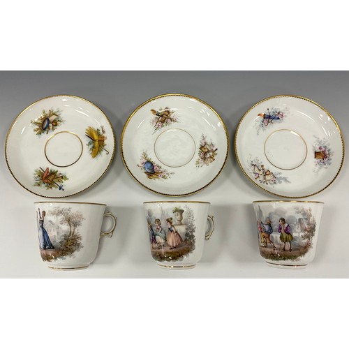 1238 - A trio of 19th century French tea cups and saucers, decorated with scenes of children play and danci... 