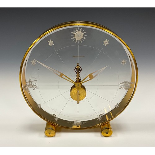 1982 - A Jaeger Le Coultre Tischuhr 'Sternzeichen, perspex and gilt metal deck clock, eight-day visible mov... 