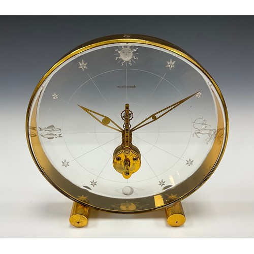 1982 - A Jaeger Le Coultre Tischuhr 'Sternzeichen, perspex and gilt metal deck clock, eight-day visible mov... 