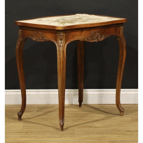 1536 - A French walnut serpentine centre table, oversailing top with shallow gallery and needlework plateau... 