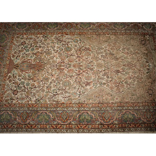 2058 - A Middle Eastern woven silk rectangular rug or carpet, the field worked with the Tree of Life beneat... 