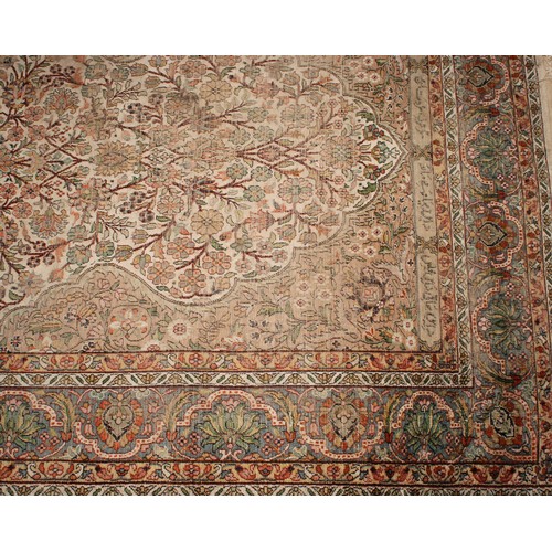 2058 - A Middle Eastern woven silk rectangular rug or carpet, the field worked with the Tree of Life beneat... 