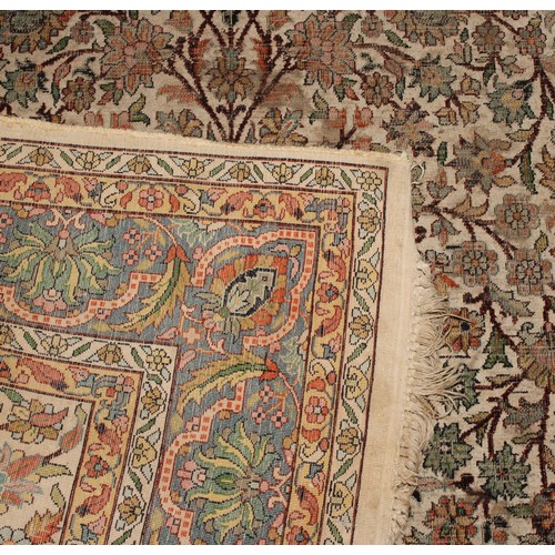 2058 - A Middle Eastern woven silk rectangular rug or carpet, the field worked with the Tree of Life beneat... 