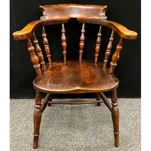 1558 - An Elm smokers’ bow armchair, well figured seat, of good colour, early 19th century.