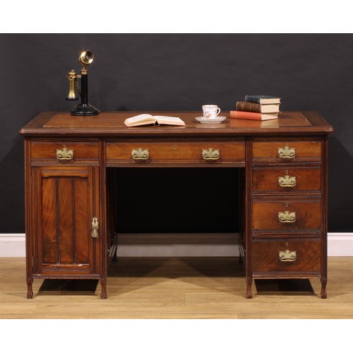 1555 - An Edwardian mahogany twin pedestal desk, rounded rectangular top with moulded edge and inset writin... 