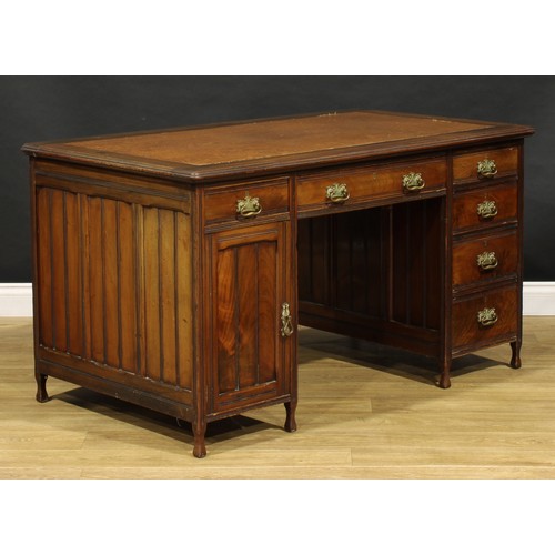 1555 - An Edwardian mahogany twin pedestal desk, rounded rectangular top with moulded edge and inset writin... 