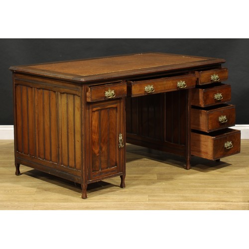 1555 - An Edwardian mahogany twin pedestal desk, rounded rectangular top with moulded edge and inset writin... 