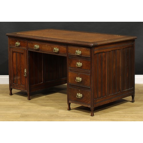 1555 - An Edwardian mahogany twin pedestal desk, rounded rectangular top with moulded edge and inset writin... 