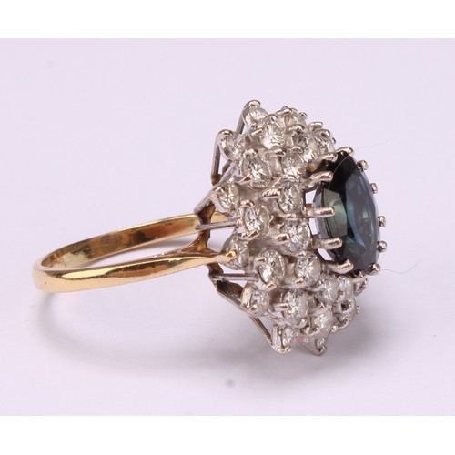 646 - A sapphire and diamond cluster ring, large oval mid blue green sapphire surrounded by three layers s... 