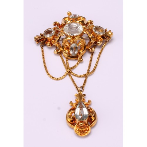 672 - A Victorian Topaz and yellow metal pendant brooch set with five oval and one pear drop pale blue top... 