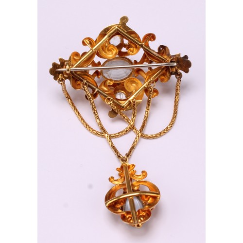 672 - A Victorian Topaz and yellow metal pendant brooch set with five oval and one pear drop pale blue top... 