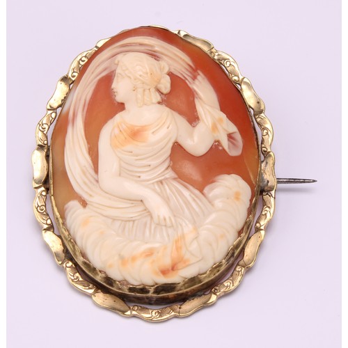 658 - A Victorian cameo brooch carved with Artemis amongst clouds beneath a scarf crest, unmarked yellow m... 