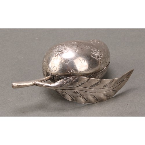 210 - A Cambodian silver coloured metal betel box, as a ripe nut, chased with flowerheads, 10.5cm wide, un... 