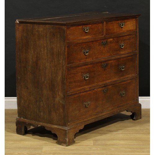 1780 - A George III oak chest, of two short and three long graduated mahogany crossbanded drawers, skirted ... 