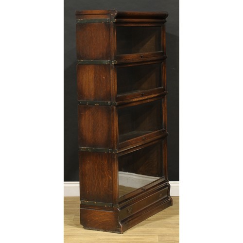 1574 - An early 20th century oak barrister's bookcase, by Globe Wernicke, comprising four modular stacking ... 