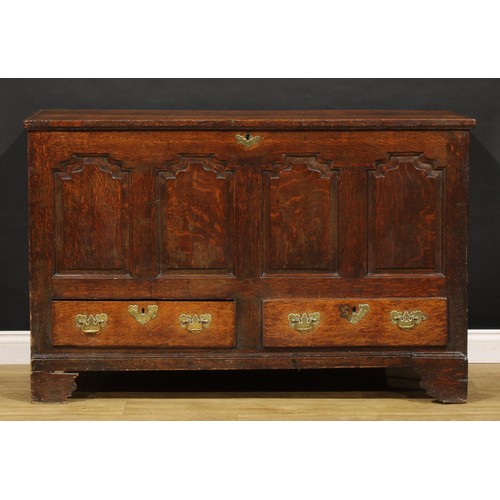 1897 - A George III oak mule chest, hinged top enclosing a till and two small drawers, the front with four ... 