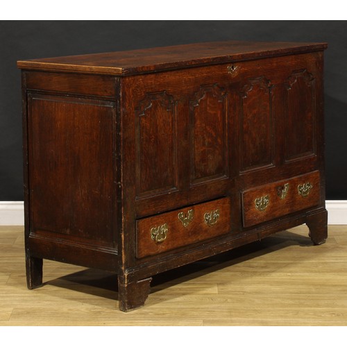 1897 - A George III oak mule chest, hinged top enclosing a till and two small drawers, the front with four ... 