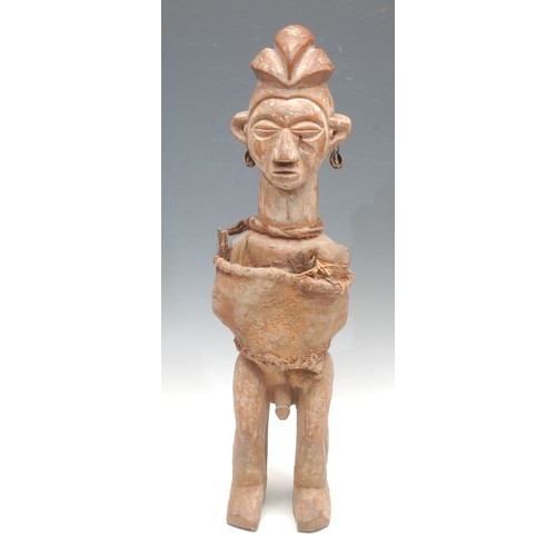 1450 - Tribal Art - a Yaka fetish figure, he stands, cloth bound and decorated with earth pigments, 54cm hi... 