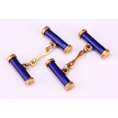 614 - A pair of 18ct gold and blue enamel cylindrical bar cufflinks, terminating in bright star cut caps, ... 