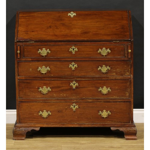 1737 - A George III mahogany bureau, fall front enclosing a small door, small drawers and pigeonholes, abov... 