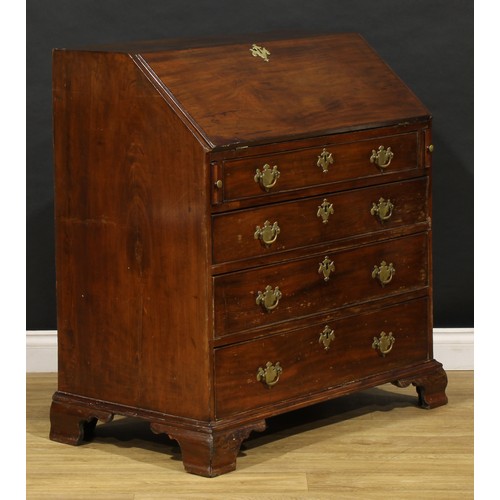 1737 - A George III mahogany bureau, fall front enclosing a small door, small drawers and pigeonholes, abov... 